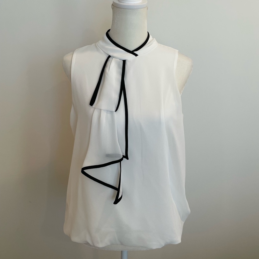 BCX top size small, white and black accented top!